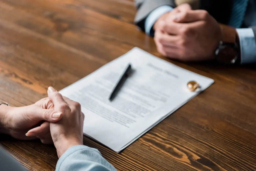 Client meeting with a Huntersville family law attorney to discuss divorce, custody, or separation paperwork.