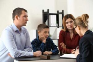 Parents with their son visiting Charlotte divorce lawyer, concept of child support