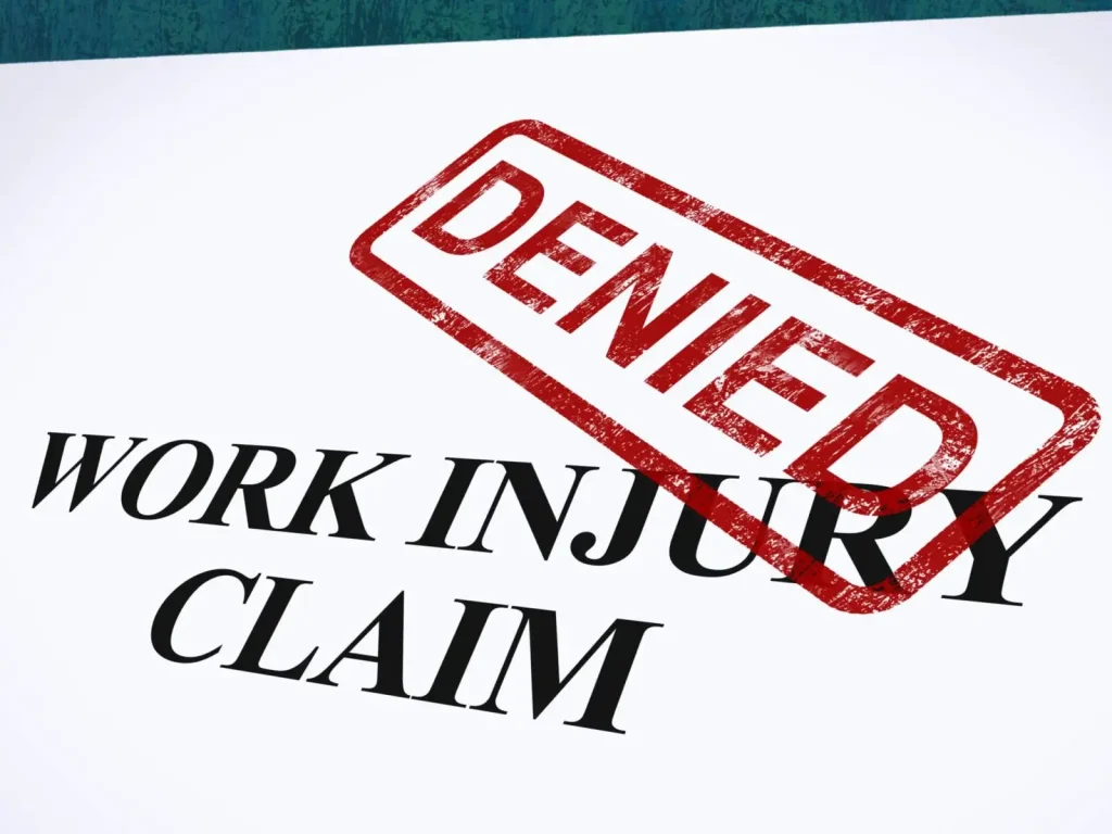 A document labeled "WORK INJURY CLAIM" with a large red "DENIED" stamp across it, representing a rejected workers' compensation claim.