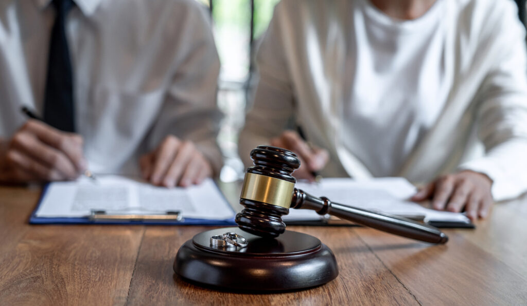 Judge’s gavel on a table during divorce litigation or family court proceedings.