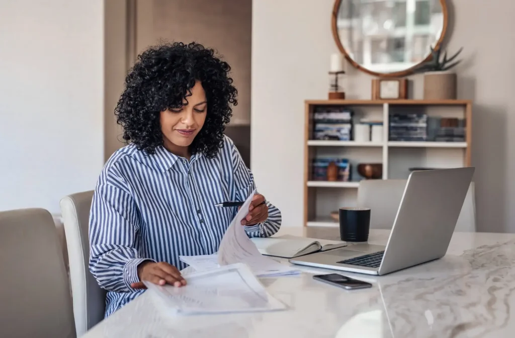 Remote worker at home desk in Charlotte representing work from home injury workers comp coverage.