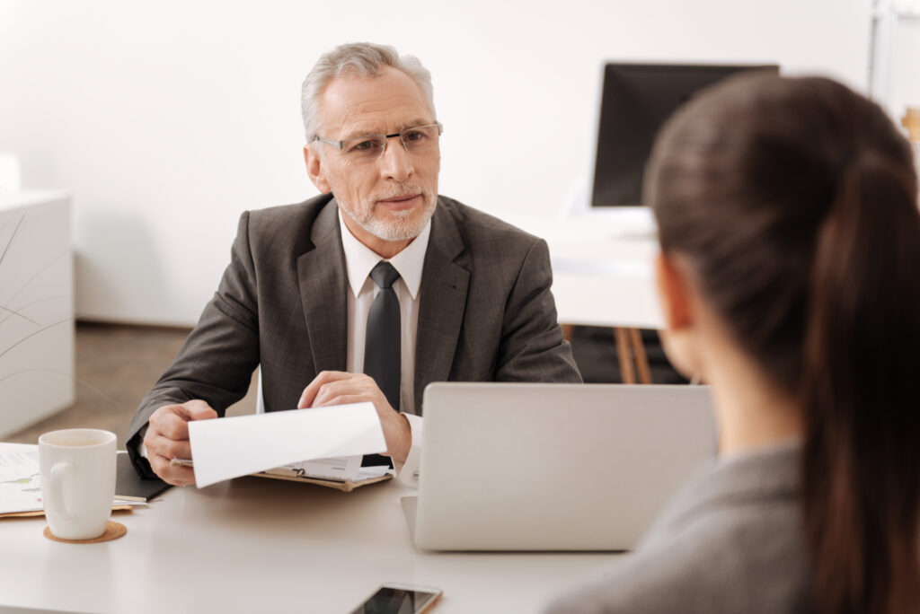 A lawyer is helping a client go over what forms to fill out, such as form 33, 24, or 61.
