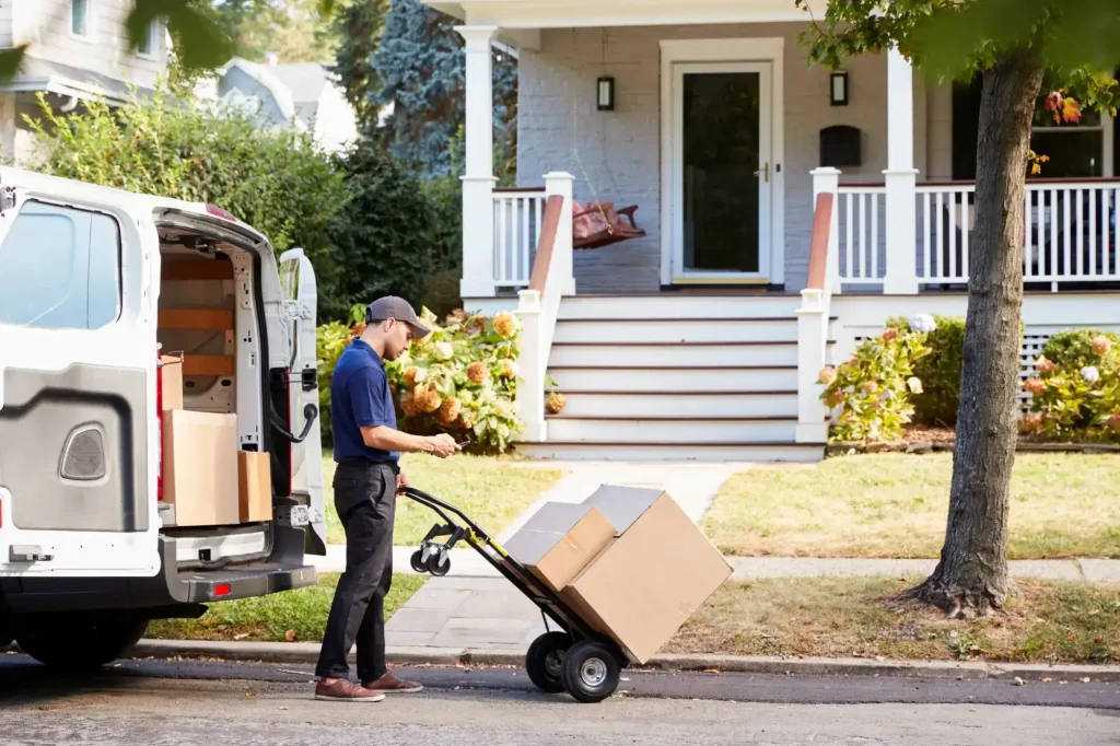 Charlotte delivery driver unloading packages representing workers' comp coverage for delivery driving injuries.