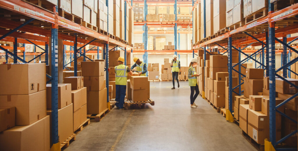 Warehouse employees working in a distribution center representing warehouse and industrial workplace injury claims in Huntersville, NC.