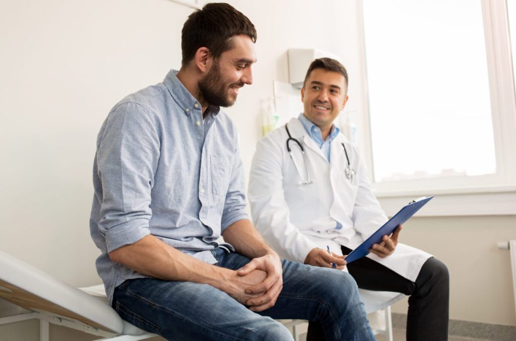Injured worker meeting with a doctor before or after a Functional Capacity Evaluation during a workers’ compensation claim.