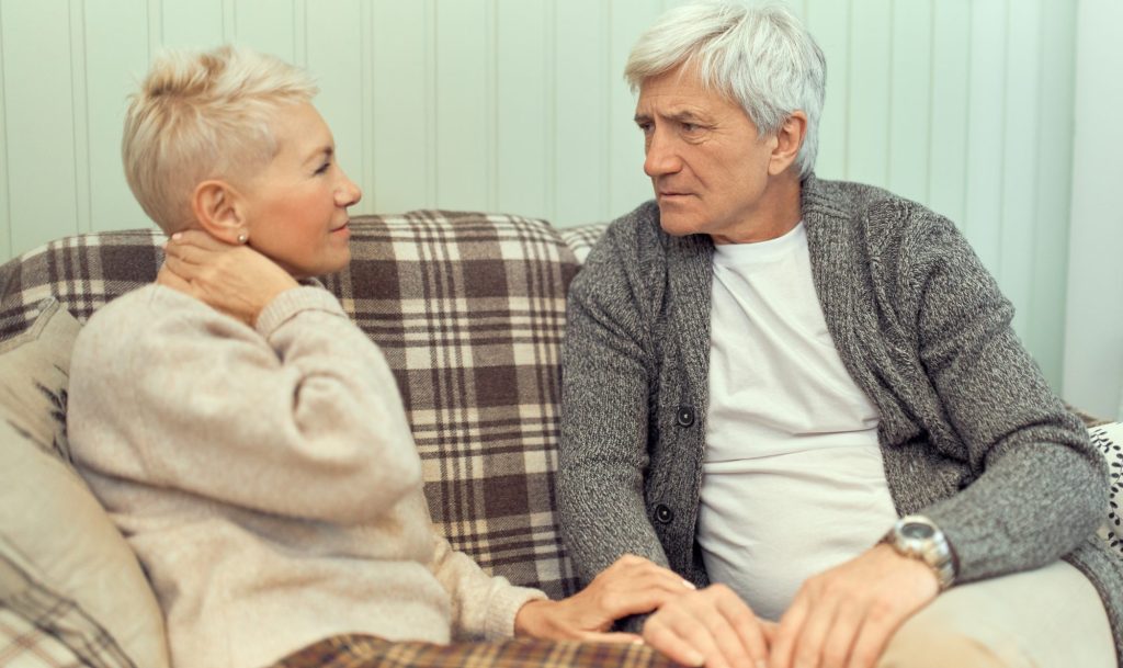 A senior couple talking about filing for divorce, consult with Gray Divorce Lawyer.
