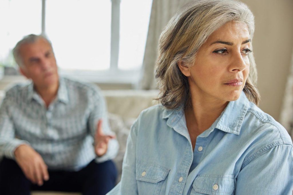 Mature couple having disagreement, when deciding to divorce after 50 meet with Gastonia Gray Divorce Attorney.