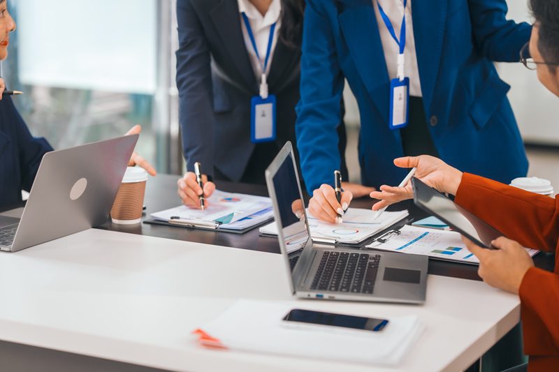 Business professionals meeting during a work conference or corporate event while traveling for work.